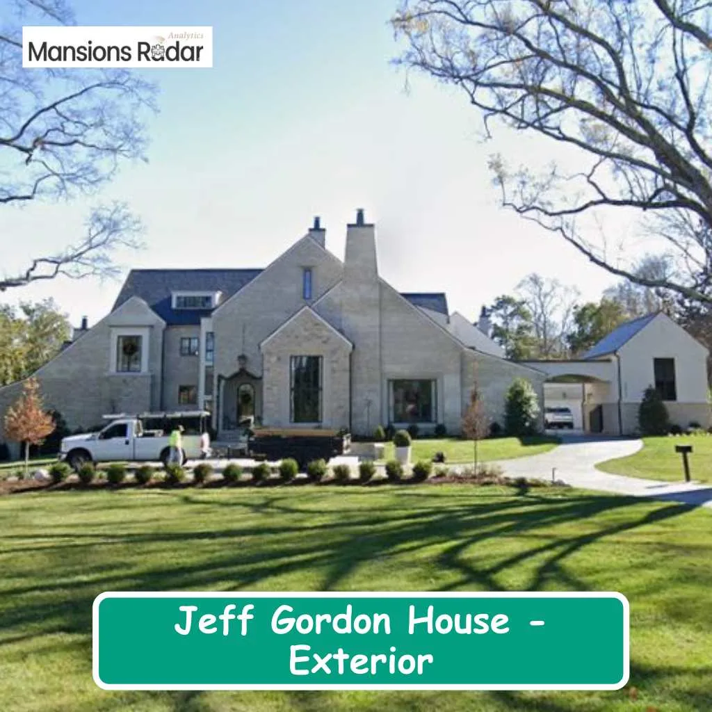 A stunning exterior view of the beautiful Jeff Gordon house surrounded by lush green lawns.