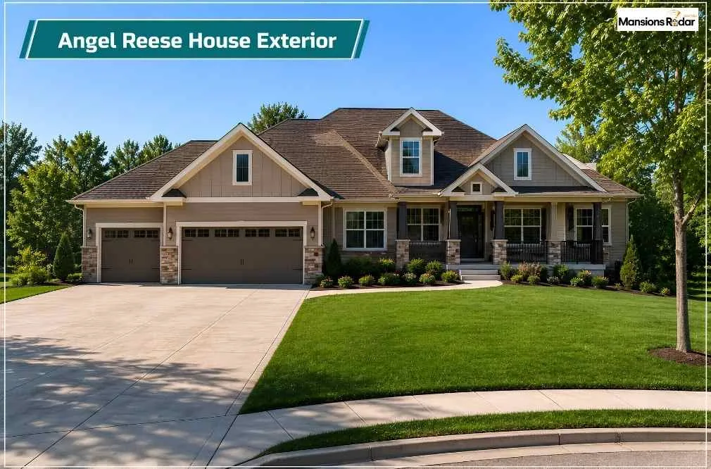 Angel Reese House exterior showcasing a spacious suburban luxury home with a three-car garage, manicured landscaping, wide driveway, covered front porch, mature trees, and bright daylight curb appeal.