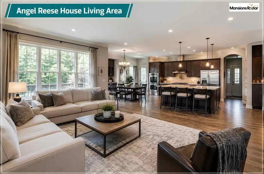 Angel Reese House living area featuring an open-concept layout, large sectional seating, expansive windows, hardwood flooring, dining space, chef’s kitchen, natural daylight, and a welcoming design for family gatherings.